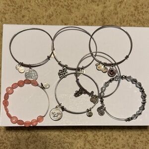 Assortment of Alex and Ani Silver and Pink Charm Bracelets